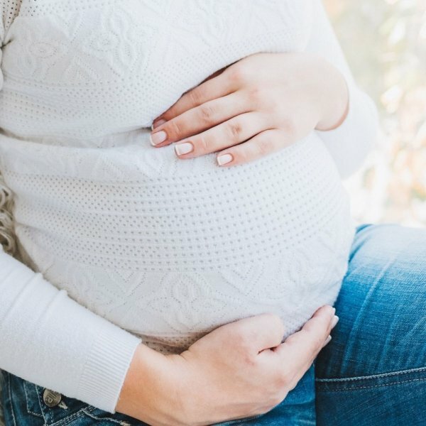 woman holding belly